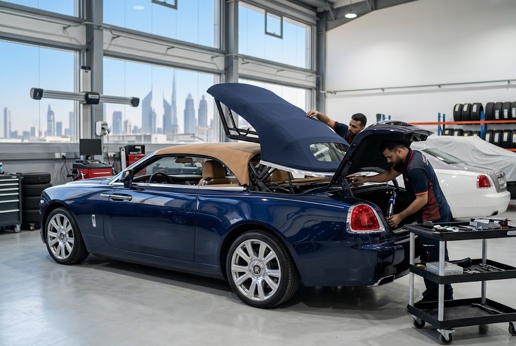 Rolls Royce Dawn convertible with soft top roof undergoing repair at an independent specialist workshop in Dubai